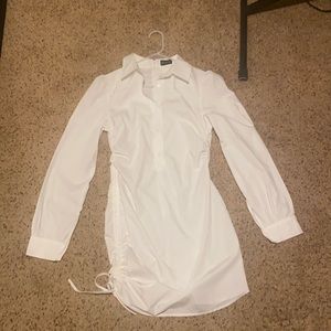 Cute classy button up dress with side scrunch!